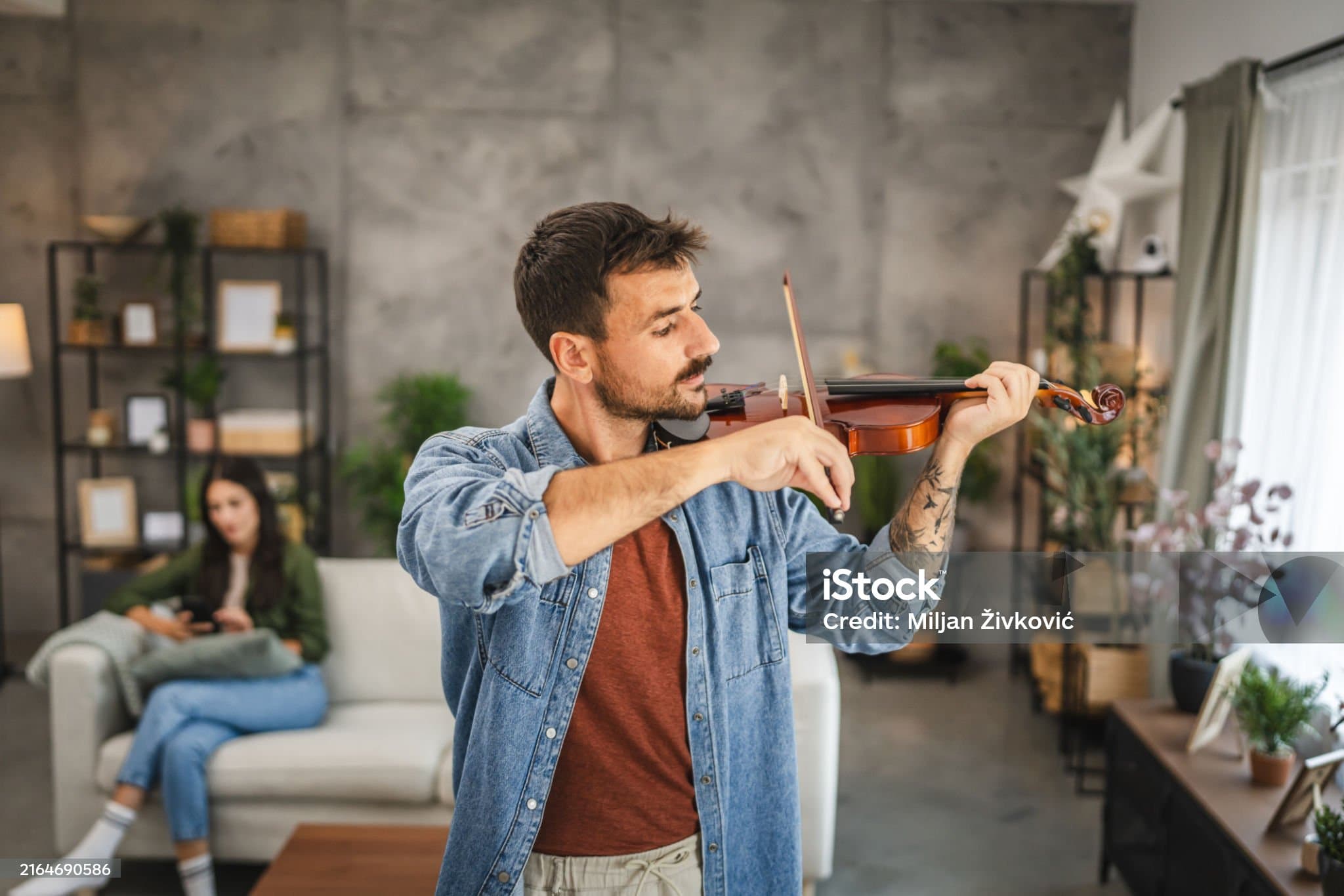 An instructor playing the violin